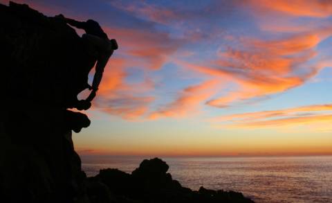 Sonoma Coast - A rock climber at Salt Point during a spectacular sunset.